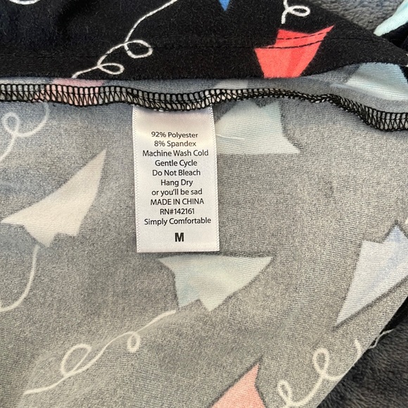 LuLaRoe Americana Irma Tunic: Black with Red, White and Blue Paper Airplanes (M) - Picture 4 of 4